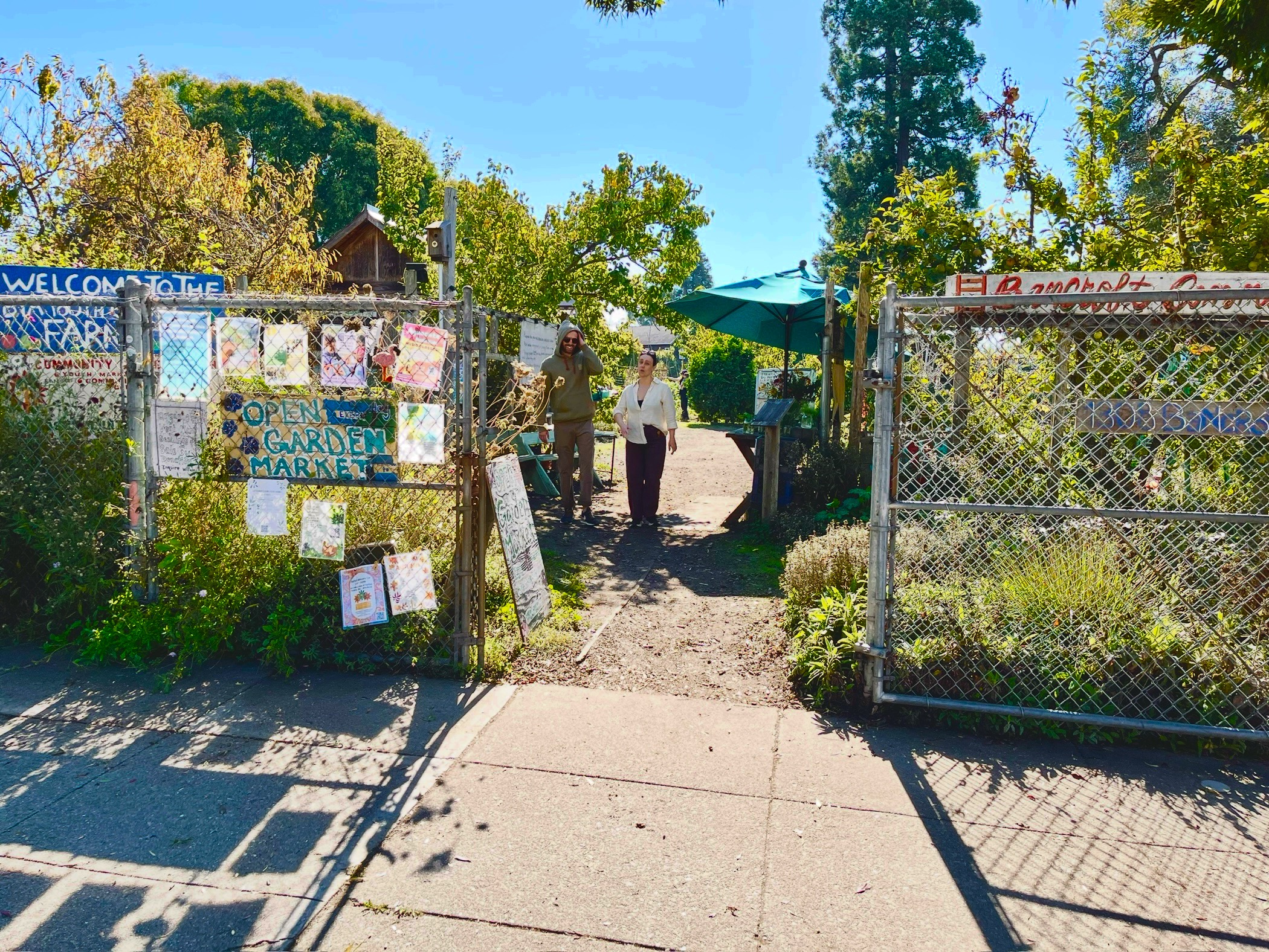 Garden entrance gate with welcome signs at Bancroft Community Garden